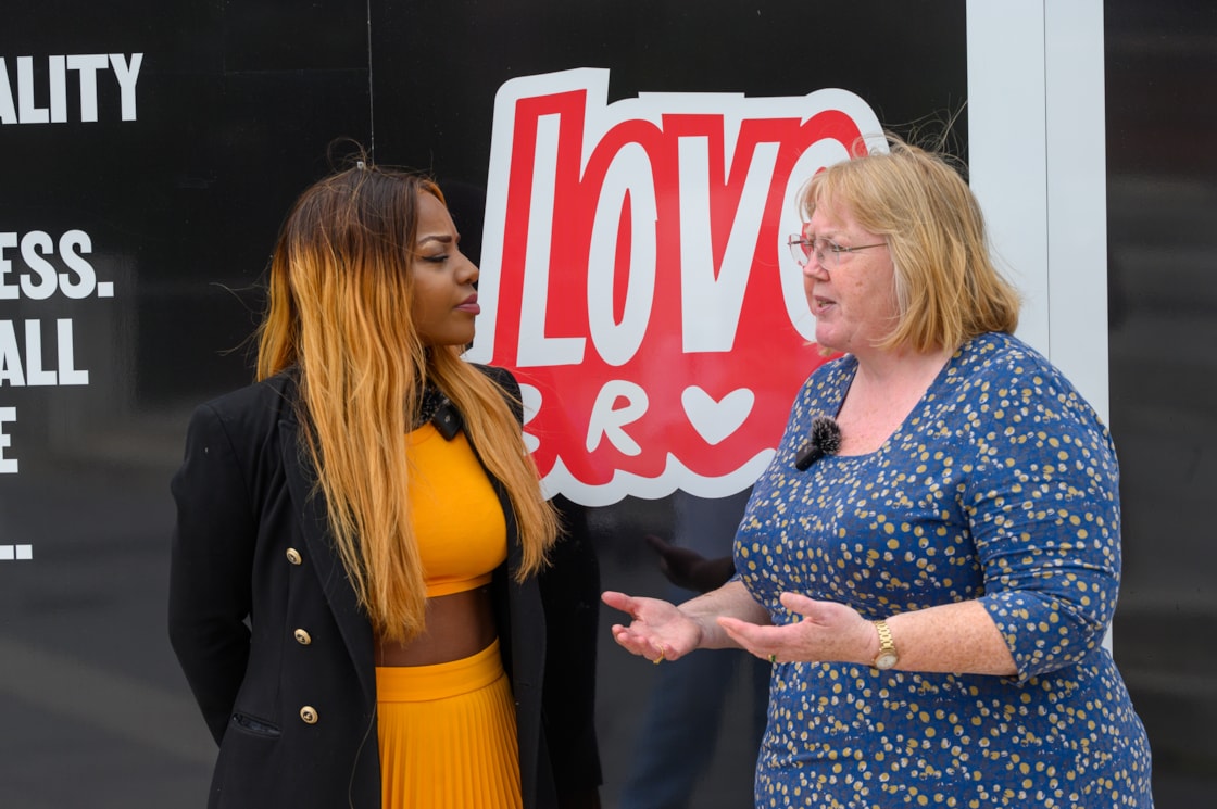 HS2's Susan Bridges (right) talking to Lindi Mngaza from Explode at the unveiling of the Love Brum hoardings