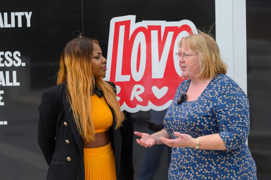 HS2's Susan Bridges (right) talking to Lindi Mngaza from Explode at the unveiling of the Love Brum hoardings