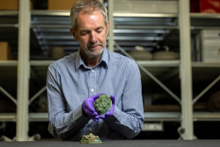 Assistant Curator Craig Angus with Viking brooches. Photo © Duncan McGlynn (4)