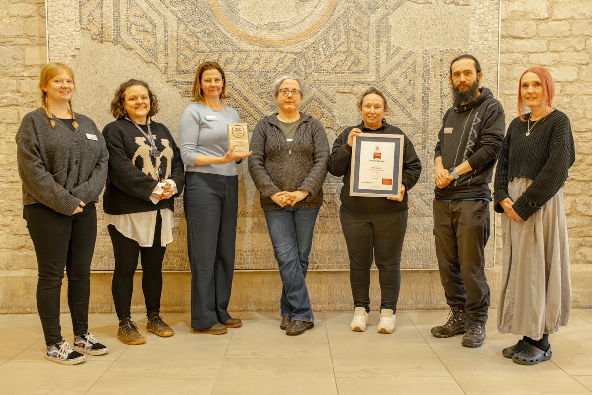 Museum staff with their certificate - credit Cirencester Camera Club