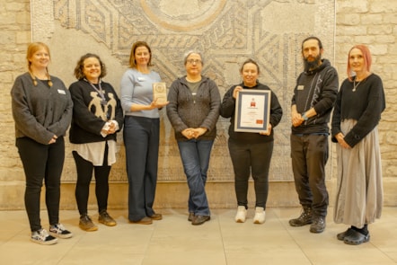 Museum staff with their certificate - credit Cirencester Camera Club