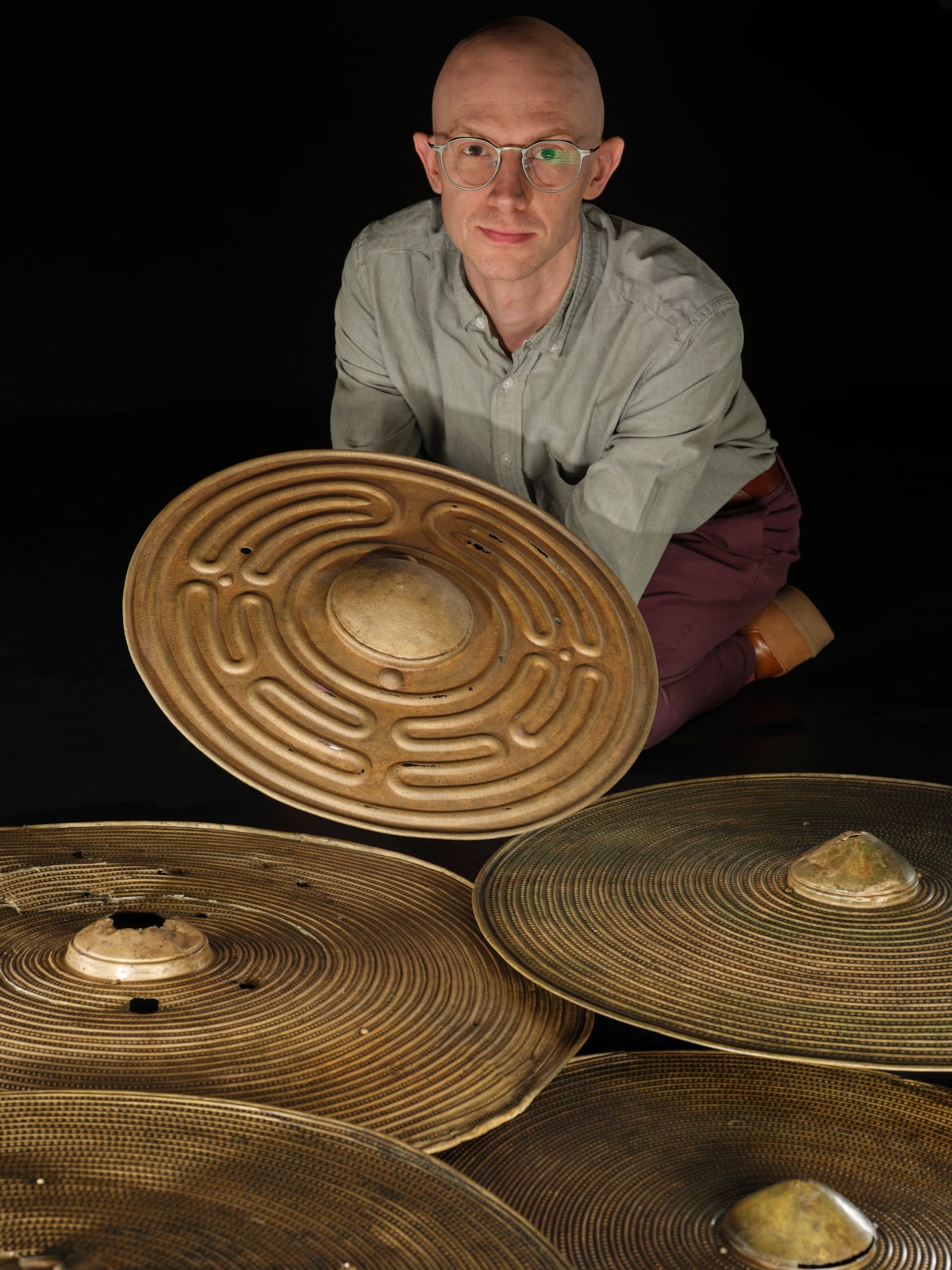 National Museums Scotland curator Dr Matthew Knight with the Bronze Age shields. Photo © Duncan McGlynn (11)