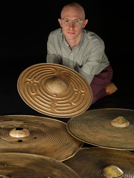 National Museums Scotland curator Dr Matthew Knight with the Bronze Age shields. Photo © Duncan McGlynn (11)