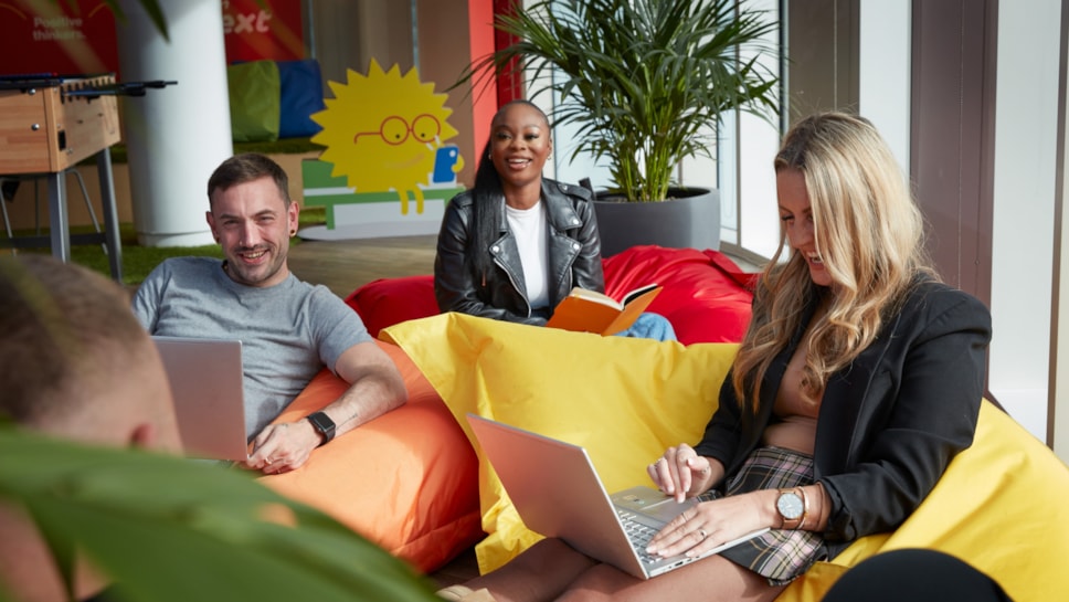 Colleagues sat on beanbags