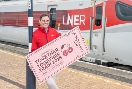 LNER Community Partnerships Manager next to LNER Azuma Train with giant ticket ahead of special Harry Styles-themed train 2