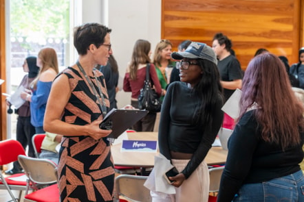 Headteacher Anna Feltham from Clapton Girls' Academy talking to a happy student