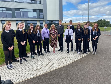 Moray Council's Head of Education, Vivienne Cross and Elgin High School Head Teacher, Hugh McCulloch, celebrate with S4, S5 and S6 pupils who received their SQ exam results on 8 August 2023.