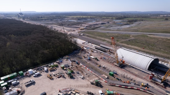 Aerial view showing the green bridge that will form the north portal of the Bat Protection Structure April 2025