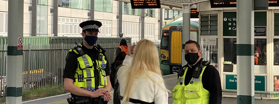 PC Lloyd and Southern employee Phil speak to a member of the public (banner)