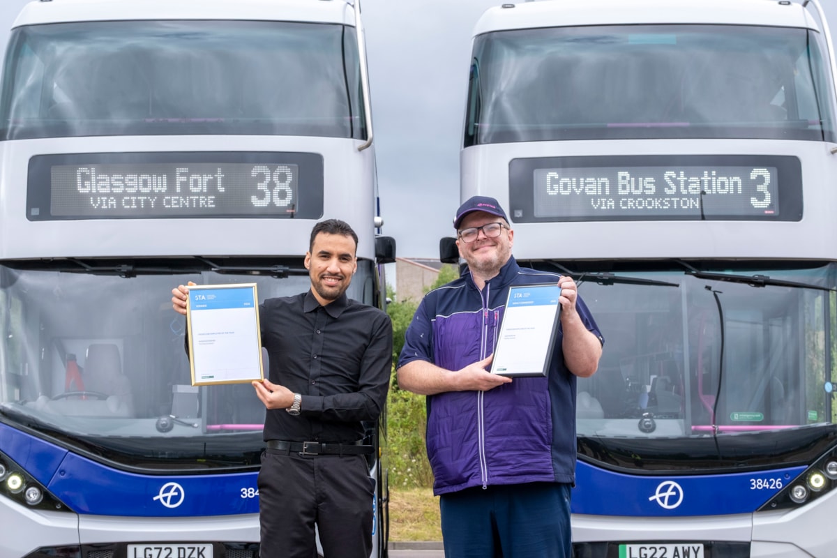 Mansour (left) and Alex show off their awards