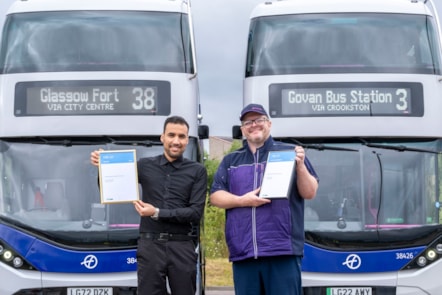 Mansour (left) and Alex show off their awards