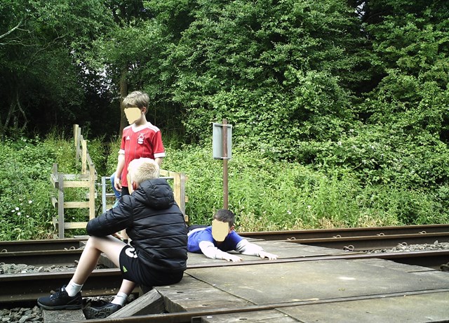 Network Rail and British Transport Police issue further warning in East Midlands as new images show children dicing with death at level crossing: Network Rail and British Transport Police issue further warning in East Midlands as new images show children dicing with death at level crossing 1-2
