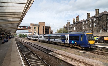 This image shows a train standing at Harrogate station