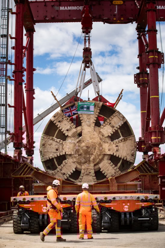 TBM Caroline lifted out of vent shaft at Green Park Way, Greenford - May 2025: HS2 lifts Tunnel Boring Machine (TBM) ‘Caroline’ from below ground at the Green Park Way site in Greenford, West London. 

On Sunday 25th May, engineers working on the HS2 project lifted the TBM 9.48metre diameter cutterhead, front and middle shield, weighing 850 tonnes, using a large gantry crane. The tunnelling machine concluded its 5mile journey from West Ruislip in April, arriving in an underground reception chamber. TBM Caroline excavated over 1.2 million tonnes of earth and installed 4,217 tunnel rings.