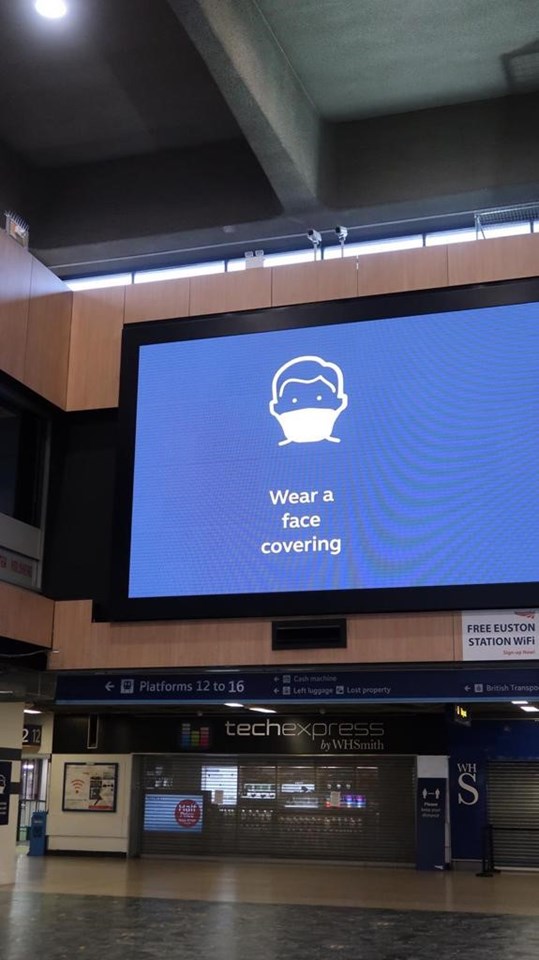 Digi-screen at Euston. Wear a face covering.