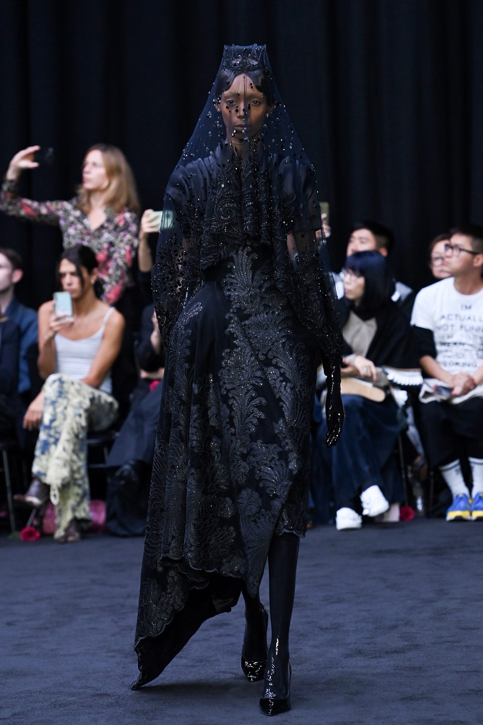 A model walks the runway during the Richard Quinn show during London ...