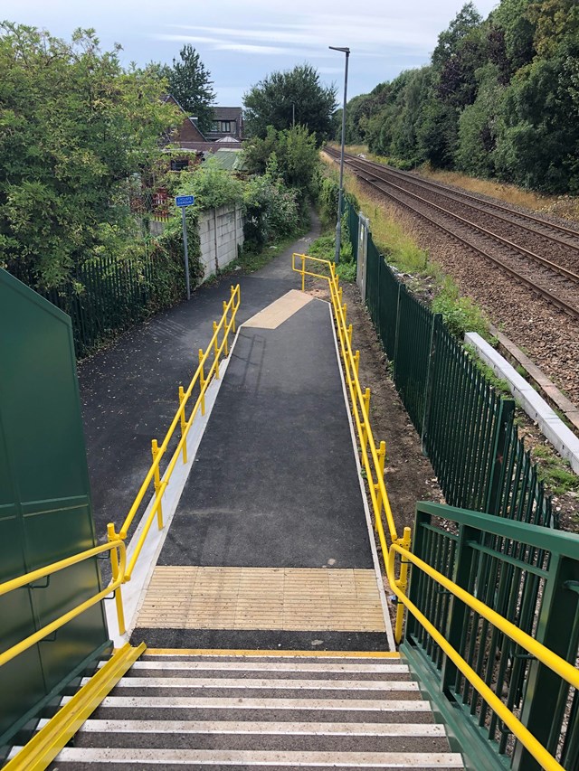 Looking down the staircase of new Bamber Bridge footbridge over the railway