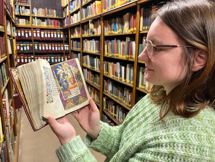 The Book of Hours: Library and digital assistant Alex Brummitt with The Book of Hours at Leeds Central Library.
Penned in around 1480 and inscribed on delicate vellum, the Horae beatae Mariae Virginis, or Book of Hours, contains forty-six vividly illuminated images depicting various duties to be carried out each month along with the signs of the zodiac.