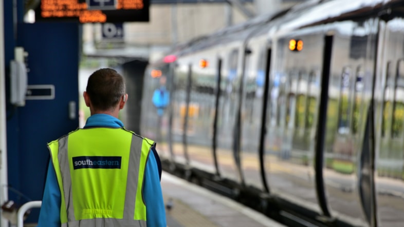 Extra Southeastern train to make it easier for school pupils to get home in east Kent: Stock image of a train and a Southeastern employee