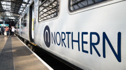 Image shows a Northern train on a platform cropped