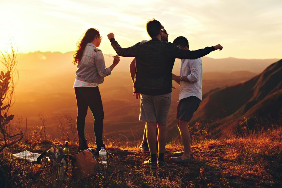 People outside at sunset