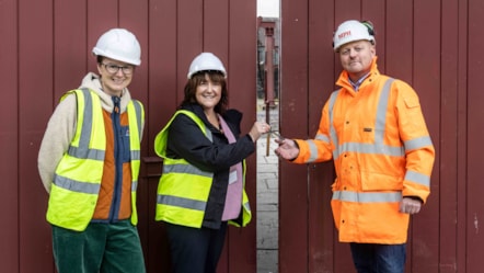 Helen Goddard and Elen Roberts of the National Slate Museum 'handover' the keys of the Museum to Eddie Williams of MPH LR