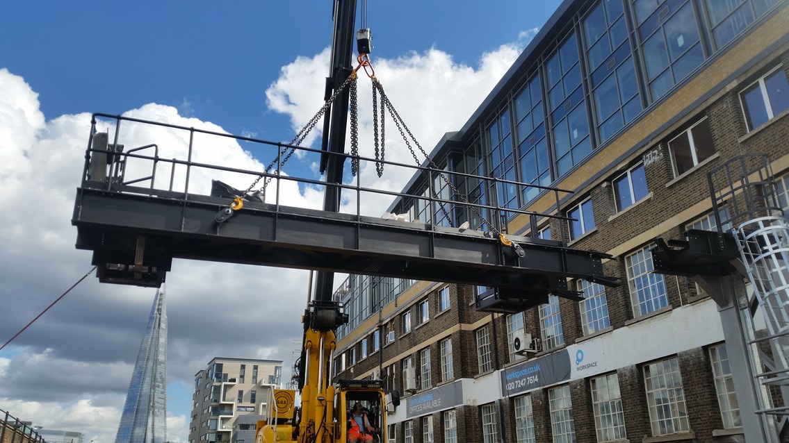 Thameslink - building towards Borough: A cantilever signal gantry is lifted into position by the Thameslink Programmeon Saturday, Sept 12, on the approaches to Waterloo East