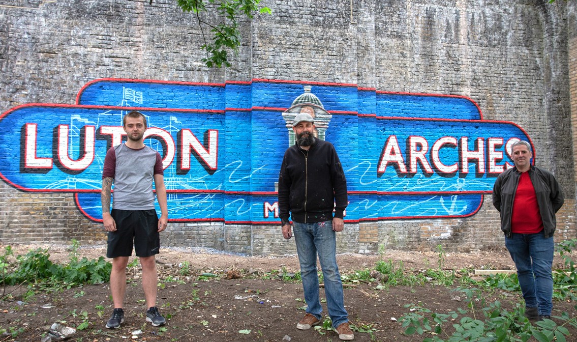 Luton arches mural, Chatham: Luton arches mural, Chatham, by Lionel Stanhope (centre) pictured with Jackson Fraser-Hague and Stephen Perez from Arches Local.