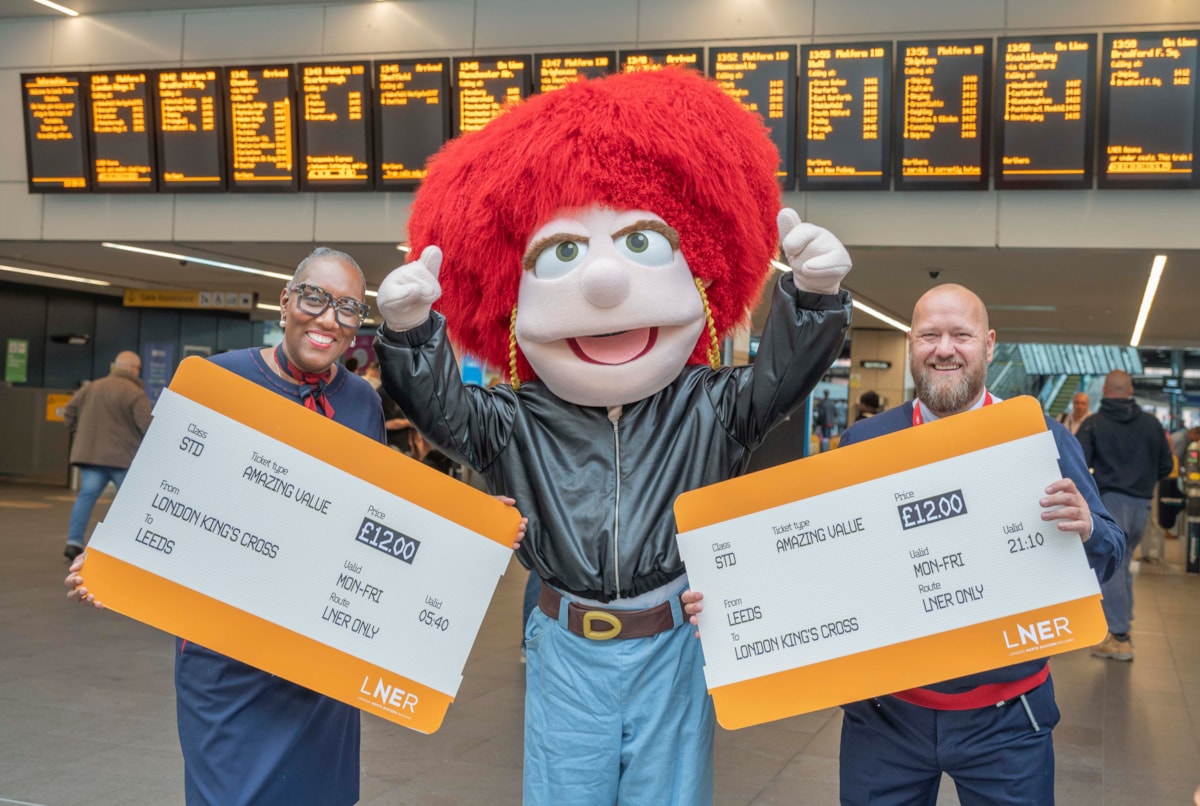LNER colleagues in Leeds station with Eleanor to share £12 fare news