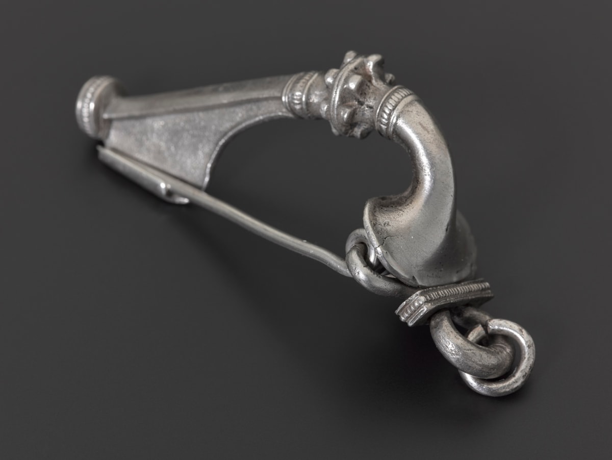 Silver trumpet brooch. Image © National Museums Scotland