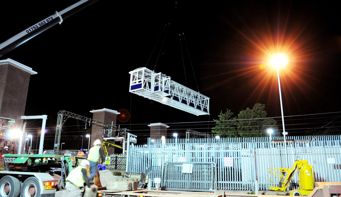 First bridge span is swung into place: The first of two bridge spans linking platform 1 with the island platforms 2 & 3 is swung into position during the royal wedding/May Day bank holiday weekend.