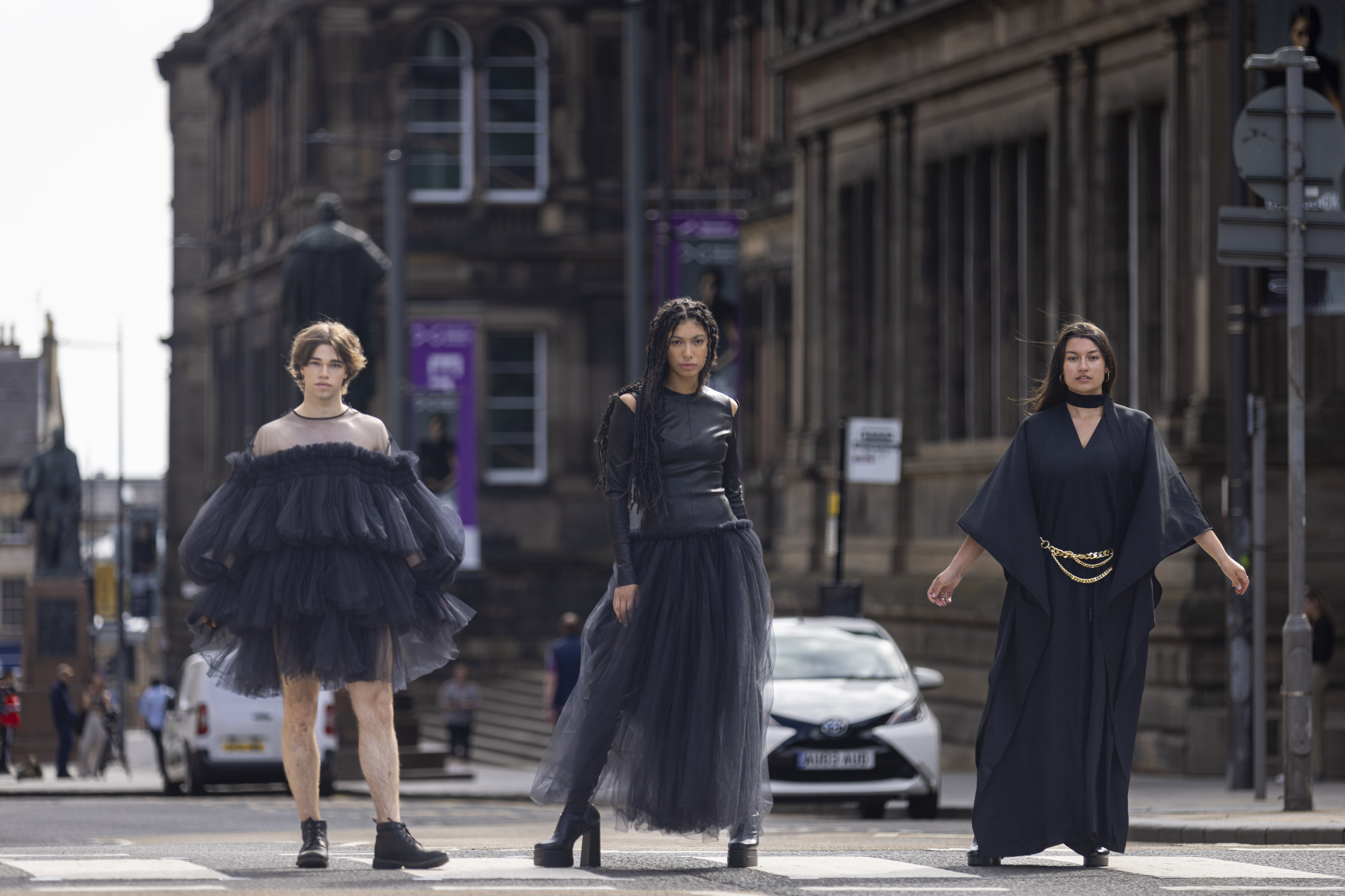 Models L R Joshua Cairns Grace Dempsey and Shannon Summers arrive at the National Museum of Scotland