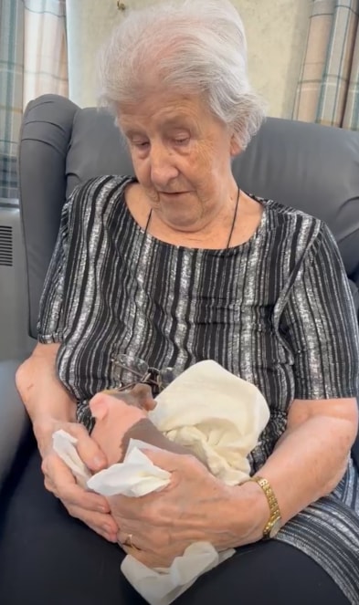 Joyce Gibson with skinny pig at Castleford care home