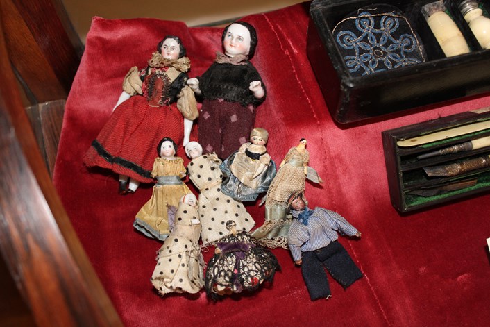 Marianne's dolls: When Florence and Marianne were children they often played with dolls. This assortment of little porcelain dolls belonged to Marianne Nicholson. She used to carry them around in a homemade purse in her pocket. The cousins could play with them anywhere.