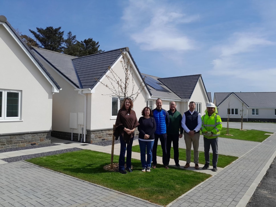 Officers and councillors outside new homes in St Davids