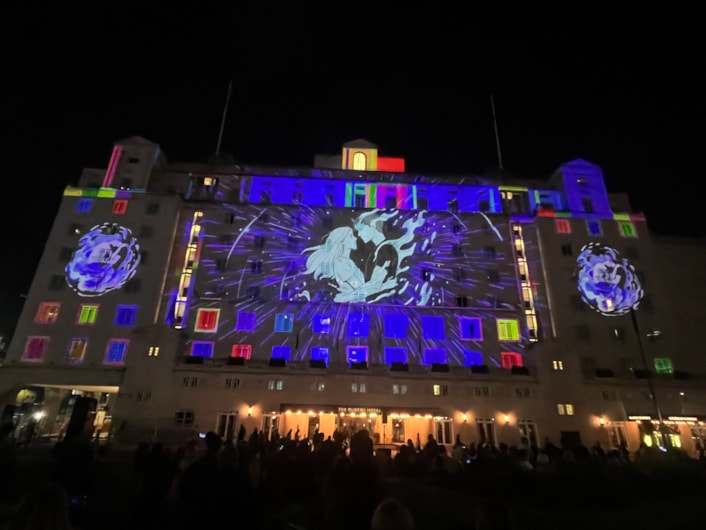 Light Night 2025: Among the captivating artworks which lit up the city last night was a spellbinding projection on City Square’s iconic Queens Hotel Entitled One Second Lovestory, created by German artist Dirk Rauscher.
Celebrating 200 years of the modern railway, the piece captures a romantic moment in time when two people’s eyes meet at a busy train station and is sponsored by Markel.