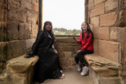 Linlithgow Scots Audio Guide: Laura Lovemore, a professional Scottish actor who provides the voice of Margaret More, one of the women known in the records as the ‘Moorish Lassies’, listening to the new Scots audio guide at Linlithgow Palace with Martha who voices the young Princess Elizabeth, daughter of James VI & Anna of Denma