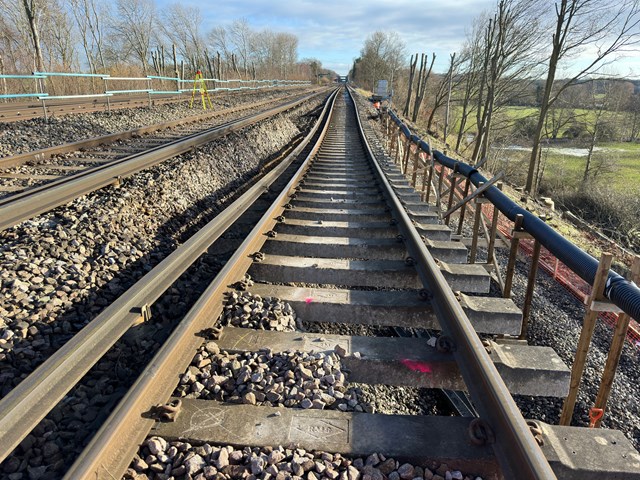 VIDEO: Network Rail engineers prepare to lay new track so more trains can run past huge landslip at Hook, Hampshire, improving service to passengers: Hook Jan 20 2