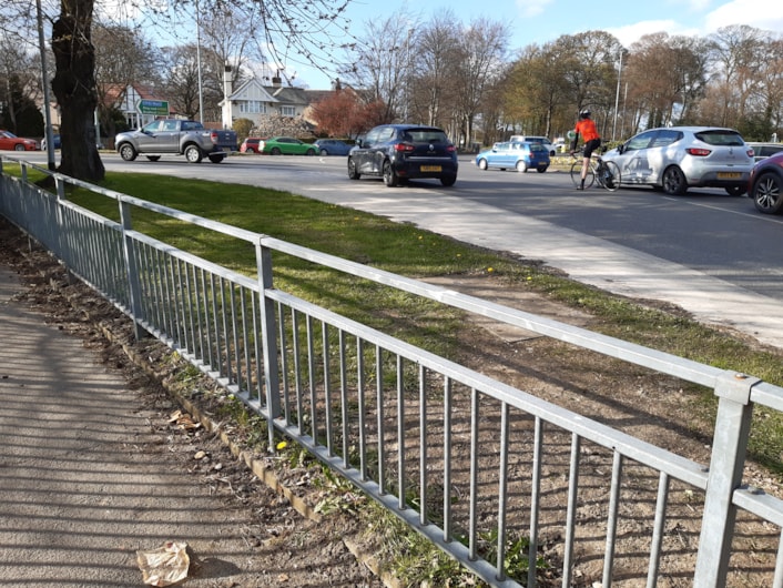 Lawnswood roundabout approach: Cars and bicycle at the Lawnswood roundabout junction
