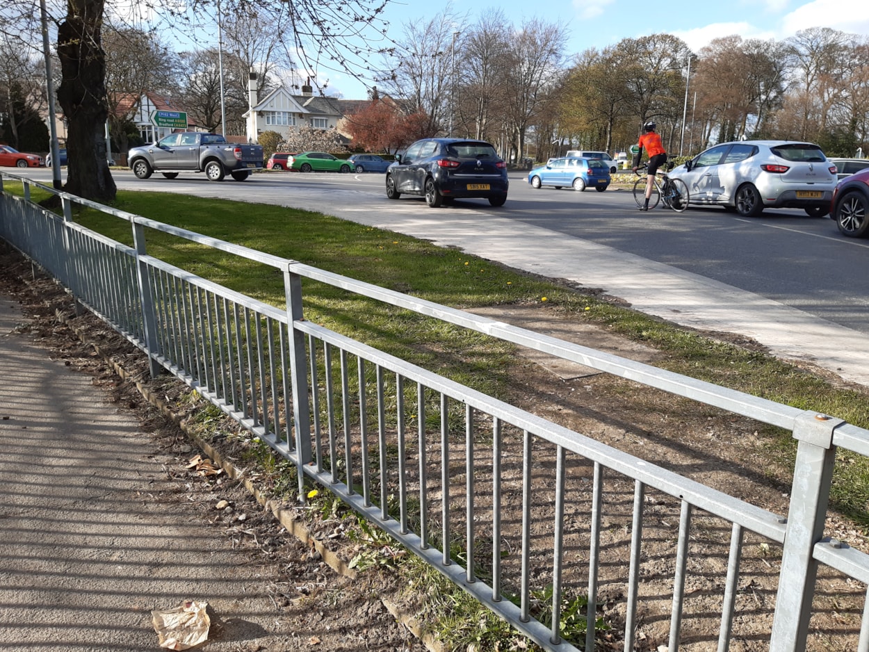 Lawnswood roundabout approach: Cars and bicycle at the Lawnswood roundabout junction