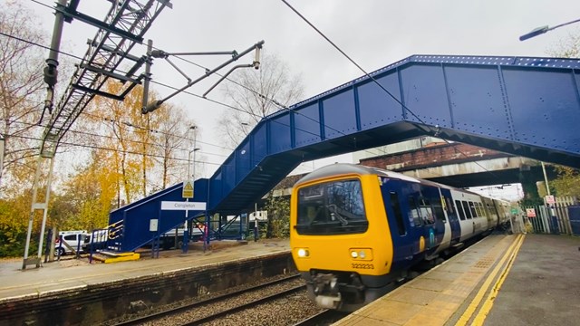 Refurbished Congleton station footbridge reopens for passengers: Congleton station footbridge with Northern service passing underneath
