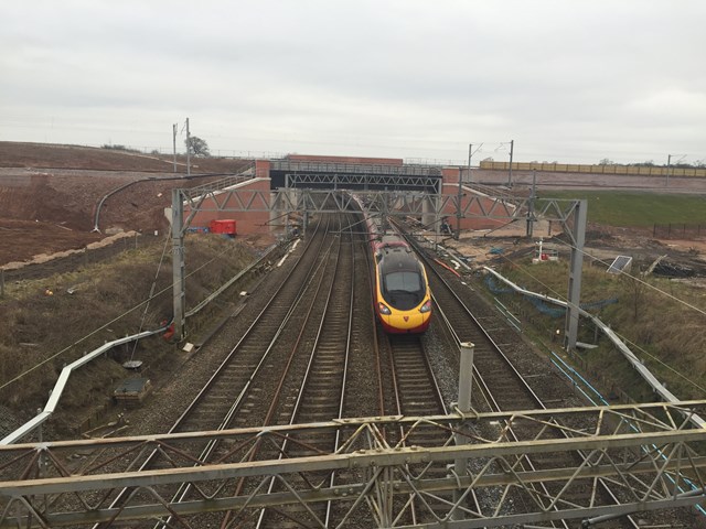 A Virgin Trains service on the West Coast main line, passing under the new Norton Bridge flyover