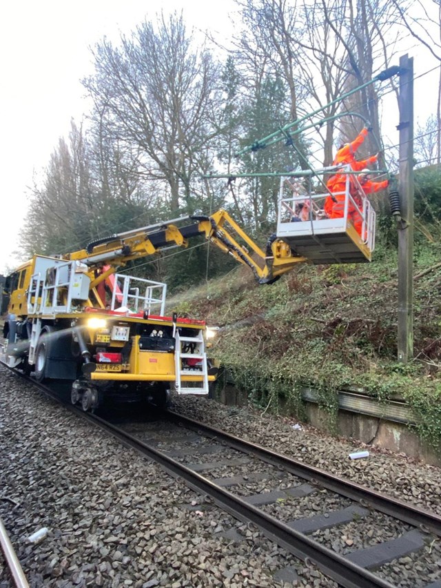 Network Rail engineers repairing damaged structure which carries 25,000 volt overhead lines at Styal