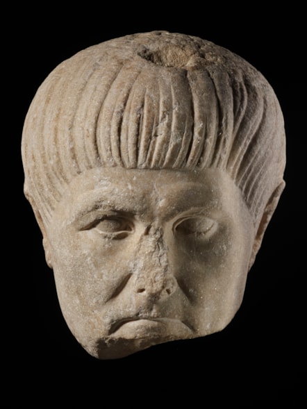 Man's head in marble, Hawkshaw, Peeblesshire, 100 - 120 AD. Image © National Museums Scotland
