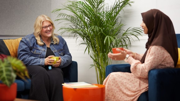Female colleagues talking-2 cropped