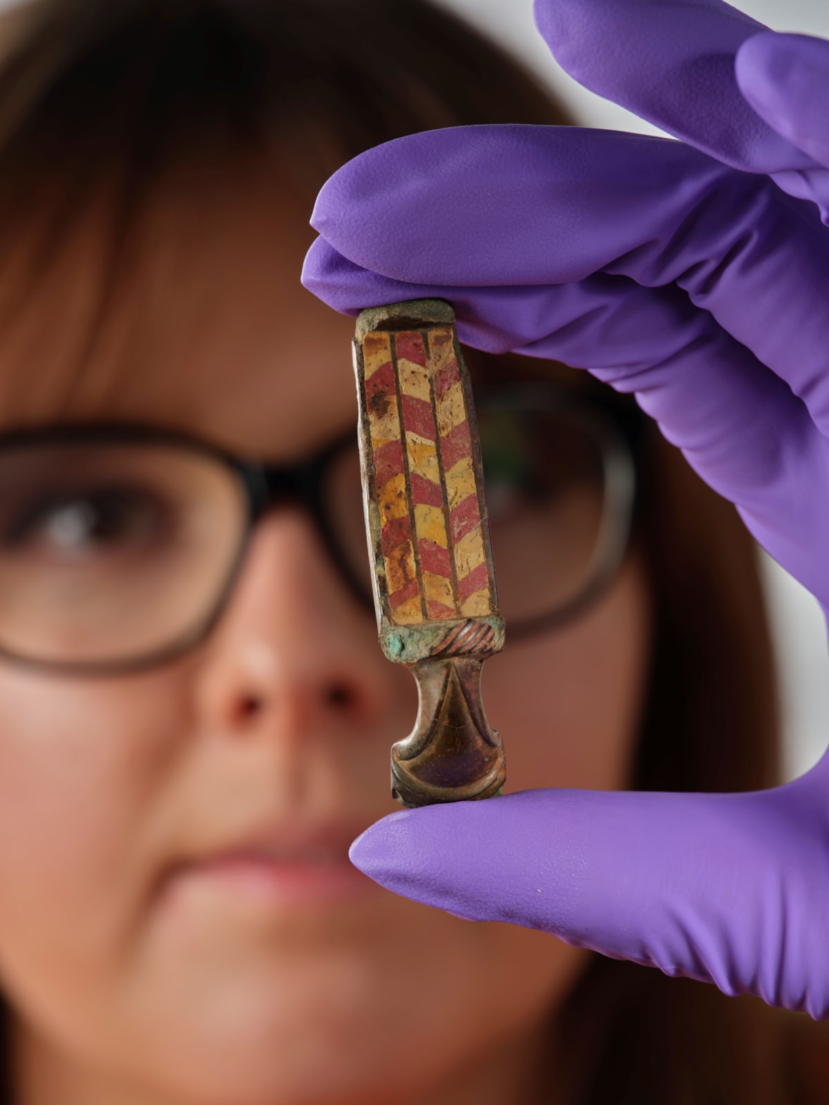 Assistant Curator Bethany Simpson with the Pathhead brooch. Image © National Museums Scotland 4