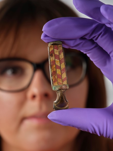 Assistant Curator Bethany Simpson with the Pathhead brooch. Image © National Museums Scotland 4