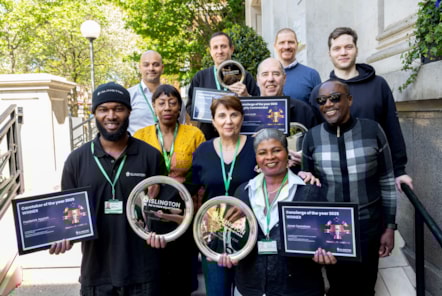 Hardworking caretakers and concierges pose outside Islington Town Hall