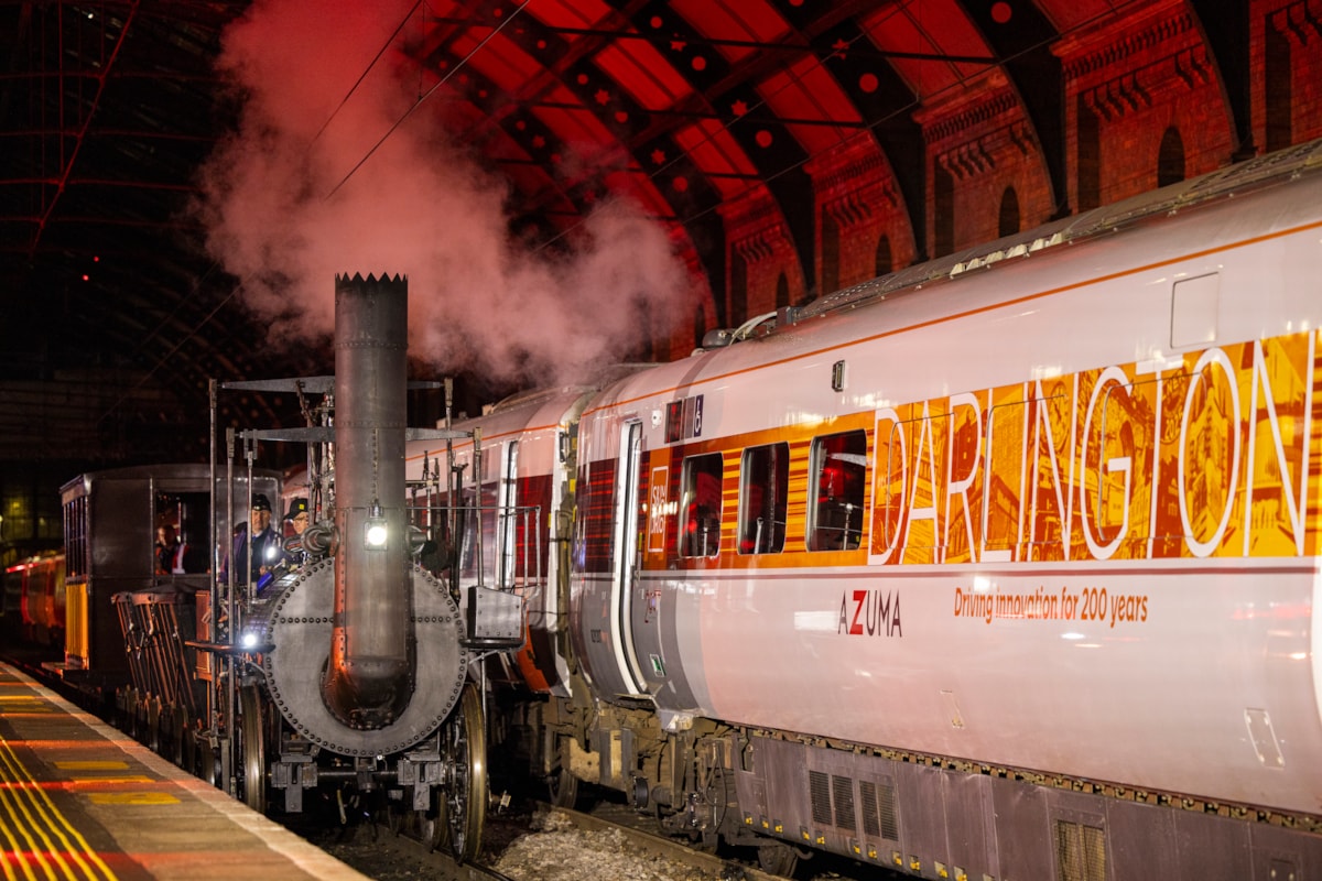 Locomotion No.1 Replica pulls alongside LNER Azuma 'Darlington' at Darlington station