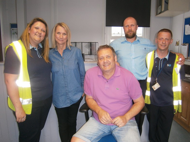 Staff save heart attack sufferer at Maidstone East station: Stuart Legg and partner Natalie Bresler with Southeastern colleagues at Maidstone East station (002)